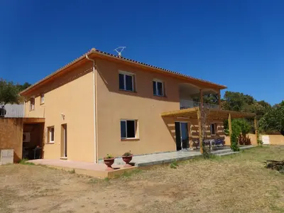 a large house with a large yard in front of it at Residence Monte Cristo in Sainte-Lucie de Porto-Vecchio