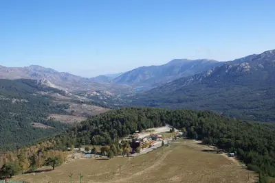 an aerial view of a valley with mountains at Castel de Vergio in Albertacce