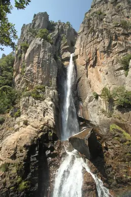 a waterfall on the side of a mountain at Casapiana in Porto-Vecchio