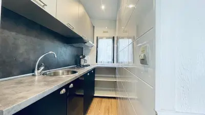 a kitchen with a sink and a counter top at Camping Trinité in Bonifacio