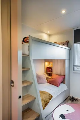 a bedroom with a bunk bed in a room at PetraLegna in Porto-Vecchio