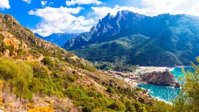 a view of a mountain valley with a river at Hôtel Idéal in Porto Ota