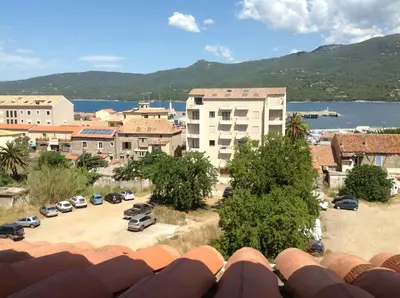 an aerial view of a city with a parking lot at Le Marina 2 in Propriano