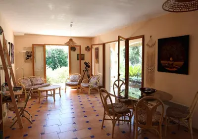 a living room with chairs and a table at Andre in Porto-Vecchio