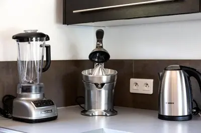 a kitchen counter with a blender on a counter top at Villa ARCA in Porto-Vecchio