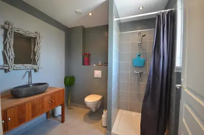 a bathroom with a sink and a toilet and a shower at Maison porto vecchio - lecci in Porto-Vecchio