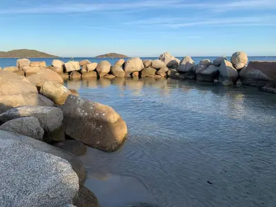 a group of large rocks in a body of water at Maison porto vecchio - lecci in Porto-Vecchio