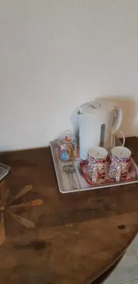 a tray with a coffee maker and cups on a table at Casa san salvadore in Favalello