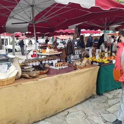 a woman standing in front of a fruit and vegetable market at **** VERY CENTRAL Ajaccio 36 rue Fesch, cosy flat in city center pedestrian street, up to 4 people **** in Ajaccio