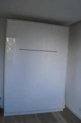 a sliding door in a room with white walls at Rustica in Prunete