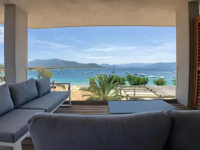 a living room with a view of the ocean at Residence Capriona in Porto Pollo