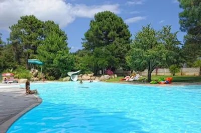 a group of people in a swimming pool at Camping Mulinacciu in Lecci