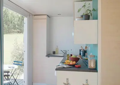 a kitchen with a counter with fruit on it at Camping Mulinacciu in Lecci