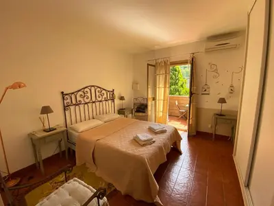 a bedroom with a large bed in a room at Hotel gite d'etape San Pasquale in Conca