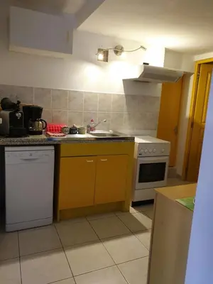 a kitchen with a sink and a stove at casabellavista in Bonifacio