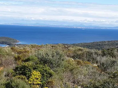 a view of the ocean from the top of a hill at casabellavista in Bonifacio