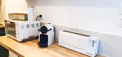 a kitchen with two appliances on a counter at Appartement Ajaccio vue mer panoramique in Ajaccio