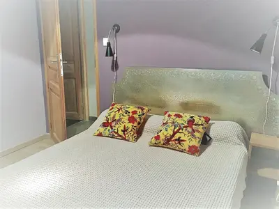 a bedroom with a bed with two pillows on it at Casa Orani in Ponte-Leccia
