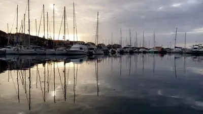 a group of boats docked in a harbor at Magnifique appartement devant la plage in Propriano