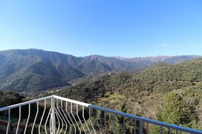 a view of the mountains from a viewing deck at VILLA SANTINE AVEC TERRASSES et VUE PANORAMIQUE meublé tourisme 4 étoiles in Santa-Lucia-di-Tallano