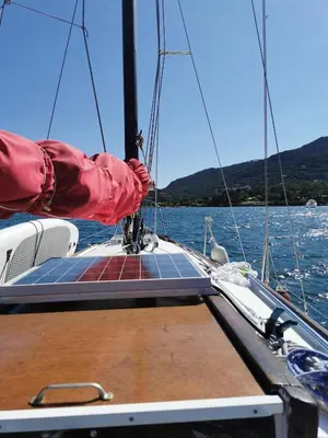 a person on a sail boat in the water at stlocavoile 2, Seuls à bord d un voilier dans le golfe in Porto-Vecchio