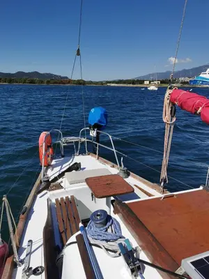 a boat in the water with two chairs on it at stlocavoile 2, Seuls à bord d un voilier dans le golfe in Porto-Vecchio