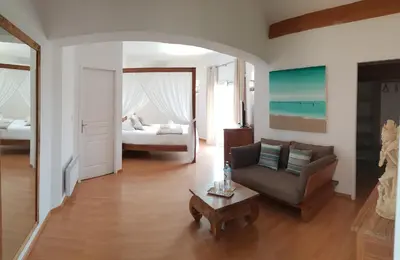 a living room with a couch and a bed at Villa Torrella in Mezzavia