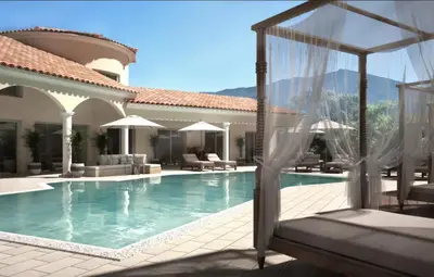 a villa with a swimming pool and a resort at Villa Torrella in Mezzavia