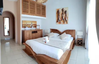 a bedroom with a bed with two teddy bears on it at Villa Torrella in Mezzavia