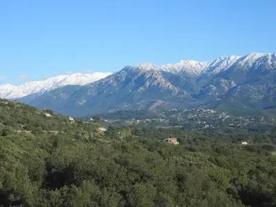 a view of a mountain range with snow covered mountains at Villa Pastriccialone in Afa