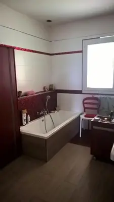 a bath tub in a bathroom with a window at Villa Pastriccialone in Afa