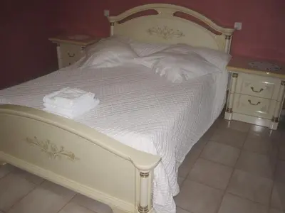 a white bed with white sheets and towels on it at Villa Pastriccialone in Afa