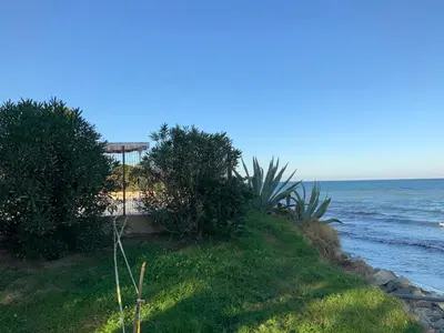 a view of the ocean from a beach at Studio Bord De Mer in Santa-Lucia-di-Moriani