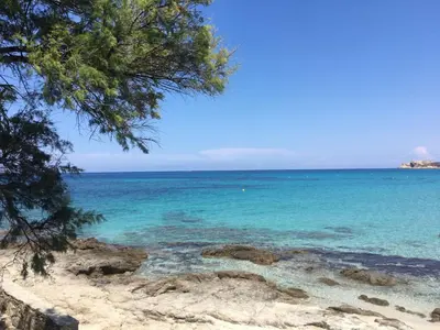 a view of the ocean from a beach at A Muvrella in Pioggiola