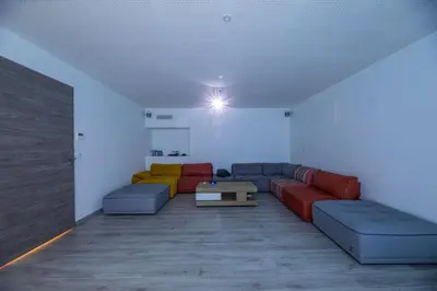 a living room with couches and a table at Villa 18 in Porto-Vecchio