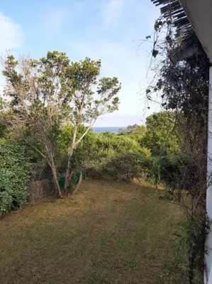 a view of the ocean from a house at Mini Villa à 100m de la mer avec prise de recharge élec privative in Sari Solenzara