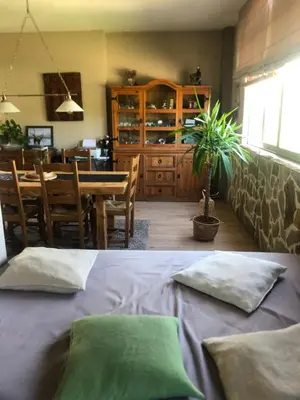 a room with a table and a bed with two pillows at Maison du bonheur in Borgo