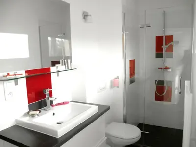 a bathroom with a sink and a toilet at Les Hauts de la Testa in Sainte-Lucie de Porto-Vecchio
