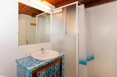 a bathroom with a sink and a mirror at Porticcio Terra Bella in Porticcio