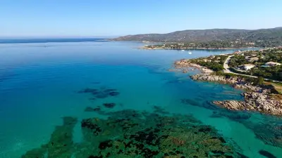an aerial view of the ocean with rocks and reefs at Résidence de Tourisme Mare e Macchia in Tizzano