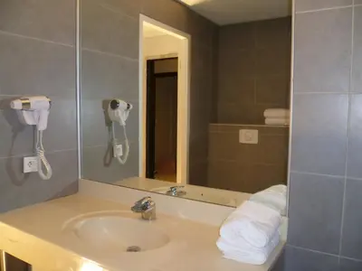 a bathroom with a sink and a mirror at Orizonte in Cervione