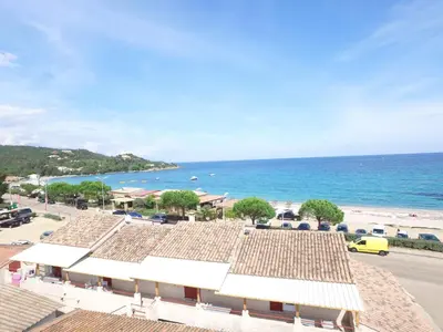 a view of the beach from the roof of a building at A Rossa Location in Favone