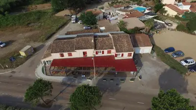an overhead view of a house with a red roof at A Rossa Location in Favone