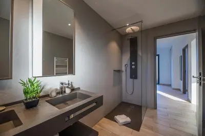 a bathroom with a sink and a mirror at Résidence Pierre & Vacances Premium Vesna Rossa in Porto-Vecchio