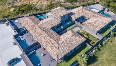 an overhead view of a house with a roof at Résidence Pierre & Vacances Premium Vesna Rossa in Porto-Vecchio