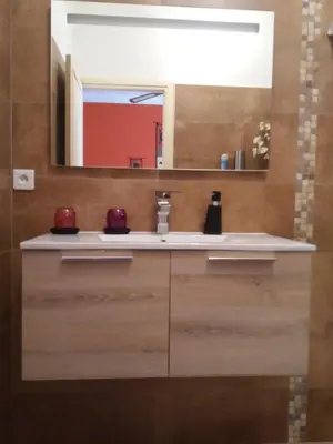 a bathroom with a sink and a mirror at Villa Savane in Ajaccio
