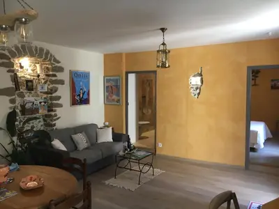 a living room with a couch and a table at Chez Marco Gîte & SPA CAPPELLINA in Muro