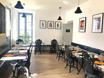 a row of tables and chairs in a restaurant at Gîte du Chalet Pietri in Olivese