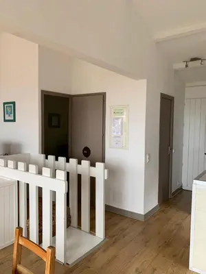 a room with a white fence in a room at Villa La Viva Porticcio in Porticcio