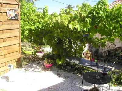 a garden with a bench and a bunch of plants at E Stelle di A Bella Vista in Bonifacio